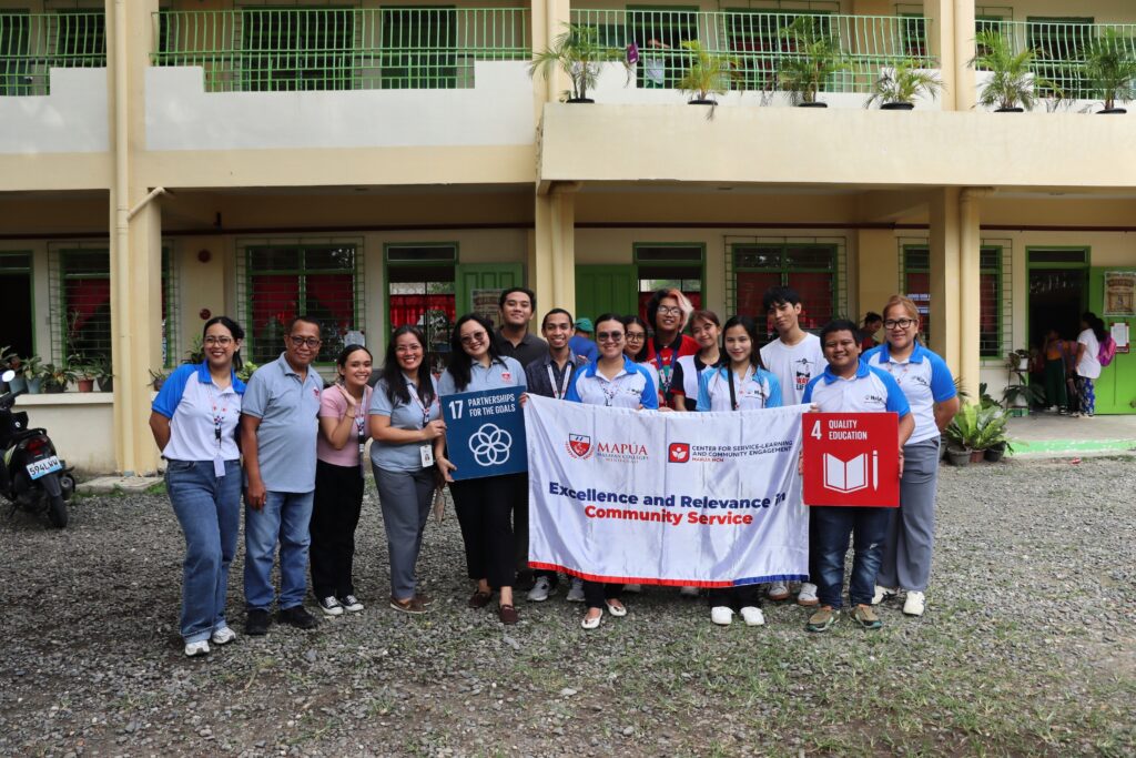 Volunteers group photo with banner