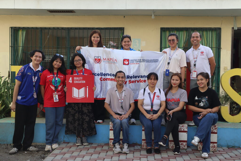 Volunteers group photo with banner
