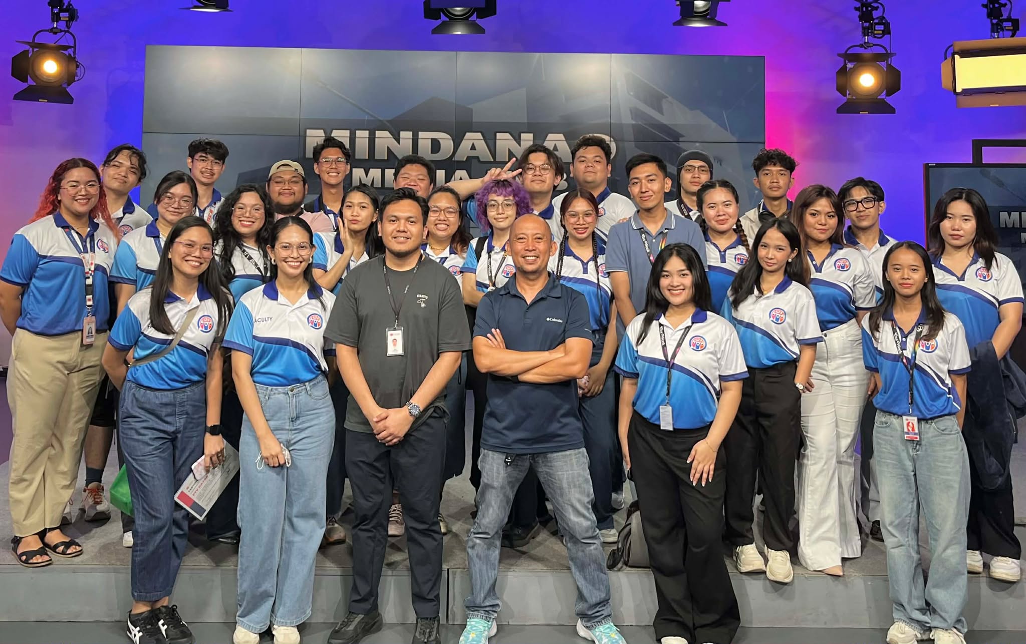 Front row from left faculty members marie gabrielle ba ang fatimah mecca samanodi mejos and jestoni jumamil together with engr clyde pudpud head of engineering at ptv davao pose with ba communication students at the mindanao media hub