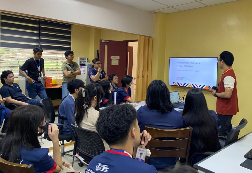 A representative from the philippine genome center mindanao introduces bioinformatics services to mapúa mcm students