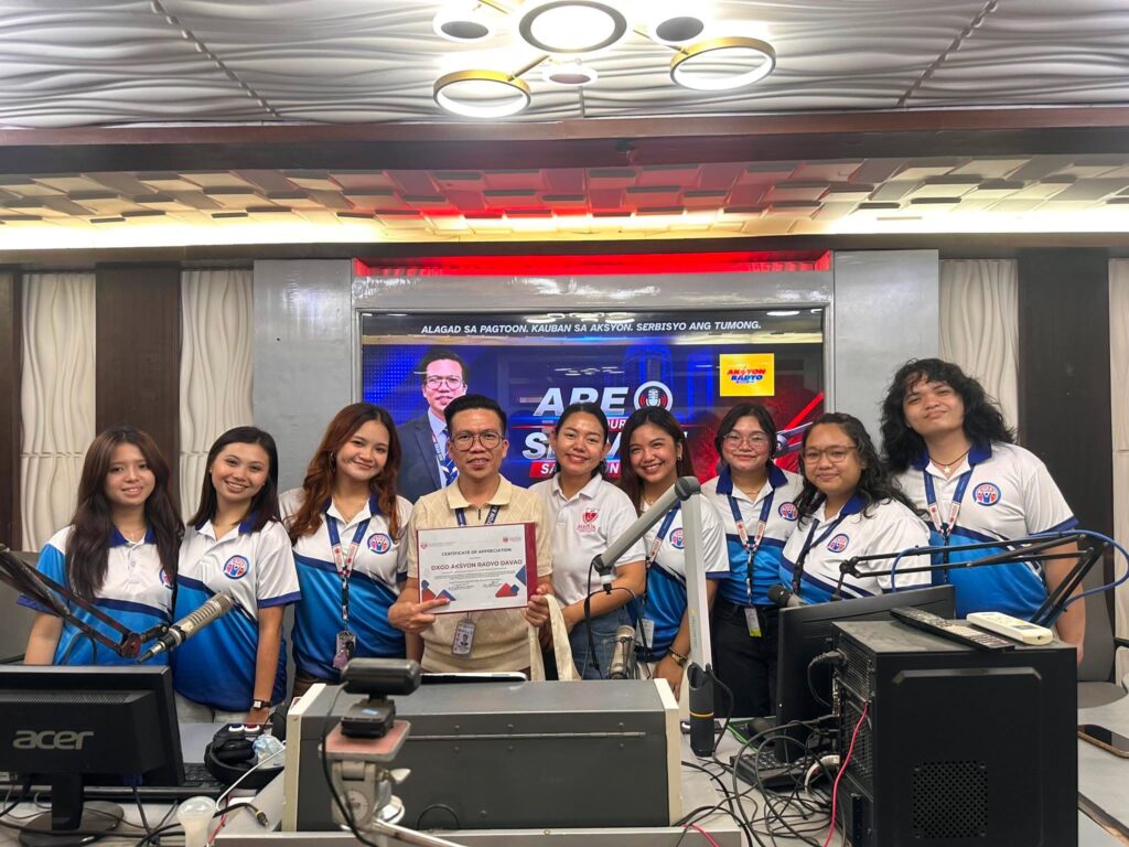 Third year ba communication students pose during their studio visit at dxgo aksyon radyo davao with their course facilitator ms Mira sol c Cabal and the stations anchor mr Apolinario bayno jr  pictured holding the certificate of appreciation presented to the station