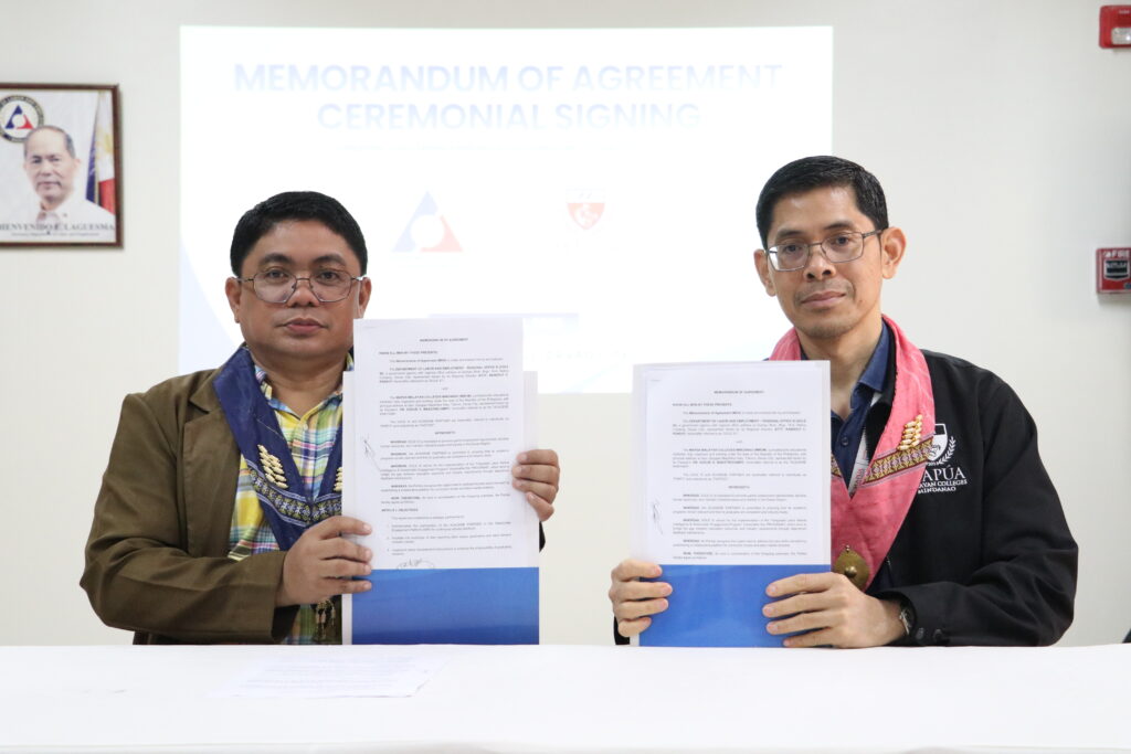 Mapúa MCM EVP COO, Engr. Alejandro H. Ballado, Jr., with DOLE XI Regional Director, Atty. Randolf C. Pensoy – Regional Director, holding the signed Memorandum of Agreement.